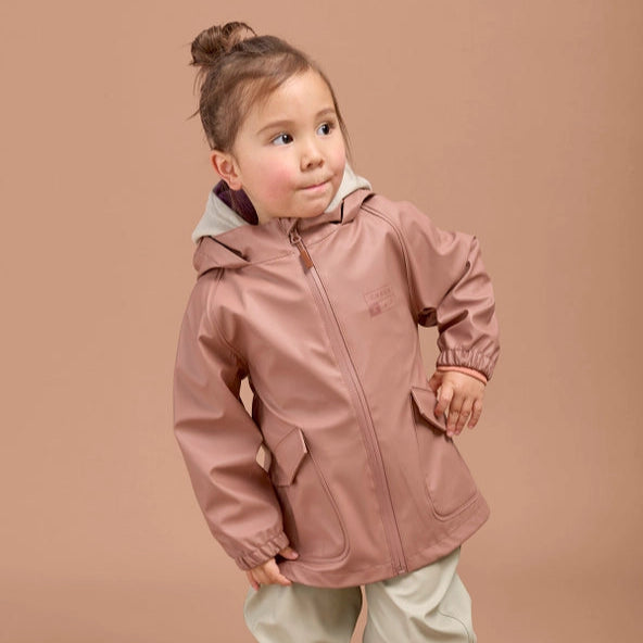Child wearing a pink Rain Jacket jacket with a hood